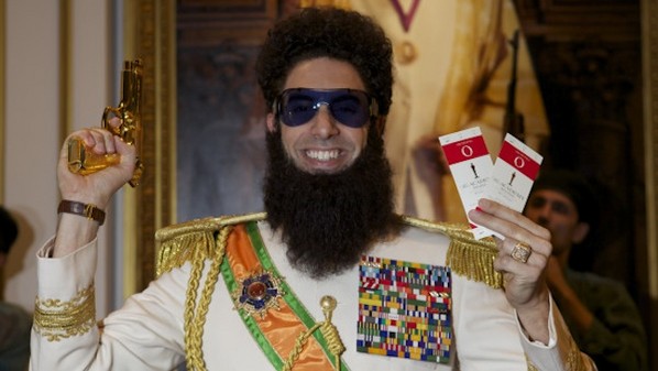 Sacha Baron Cohen Tweets Photo With Oscar Tickets and Gun: 'VICTORY!'